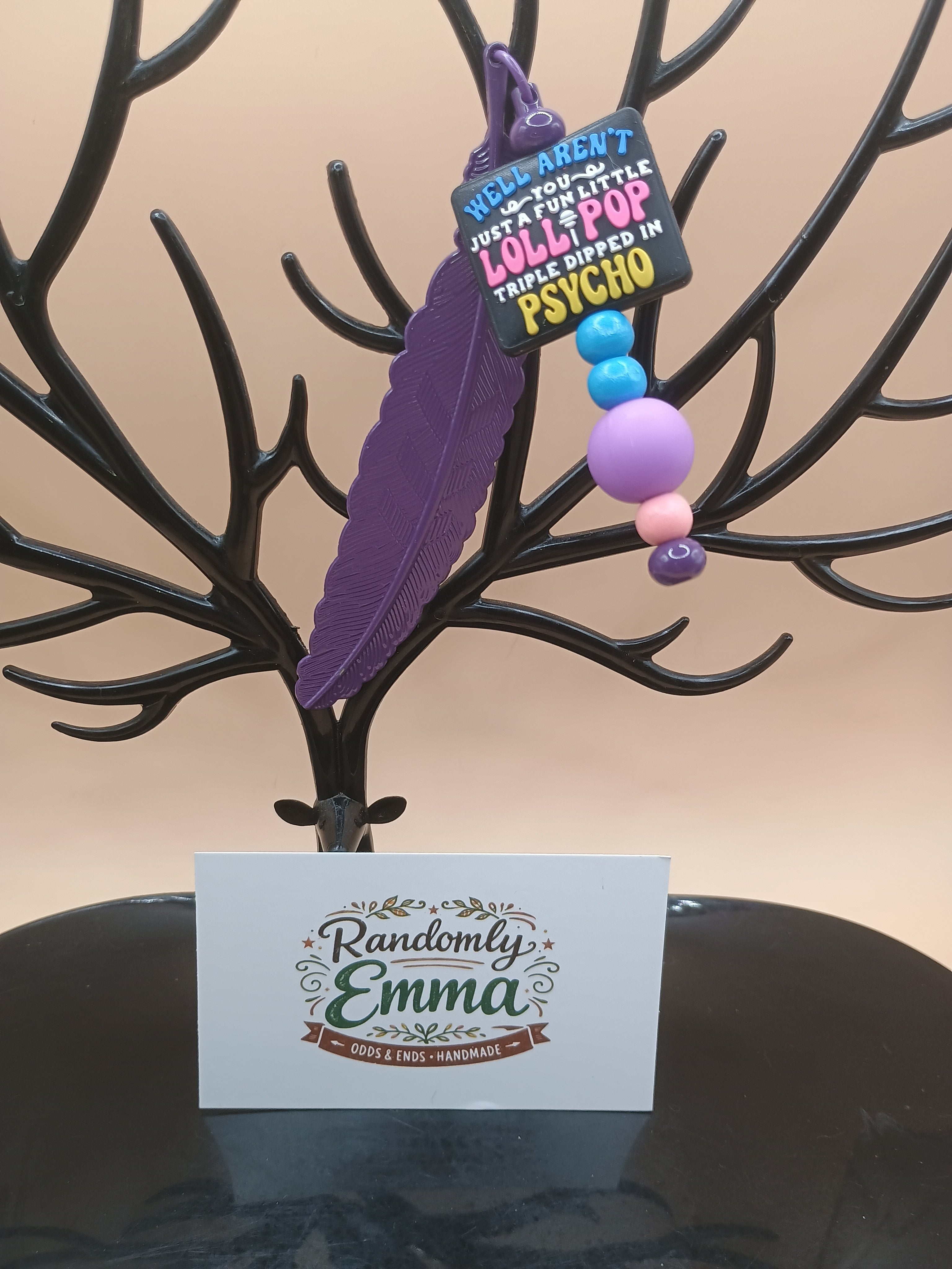 “Fun Little Lollipop Triple Dipped in Psycho” Feather Bookmark – Purple Metal Beaded Bookmark