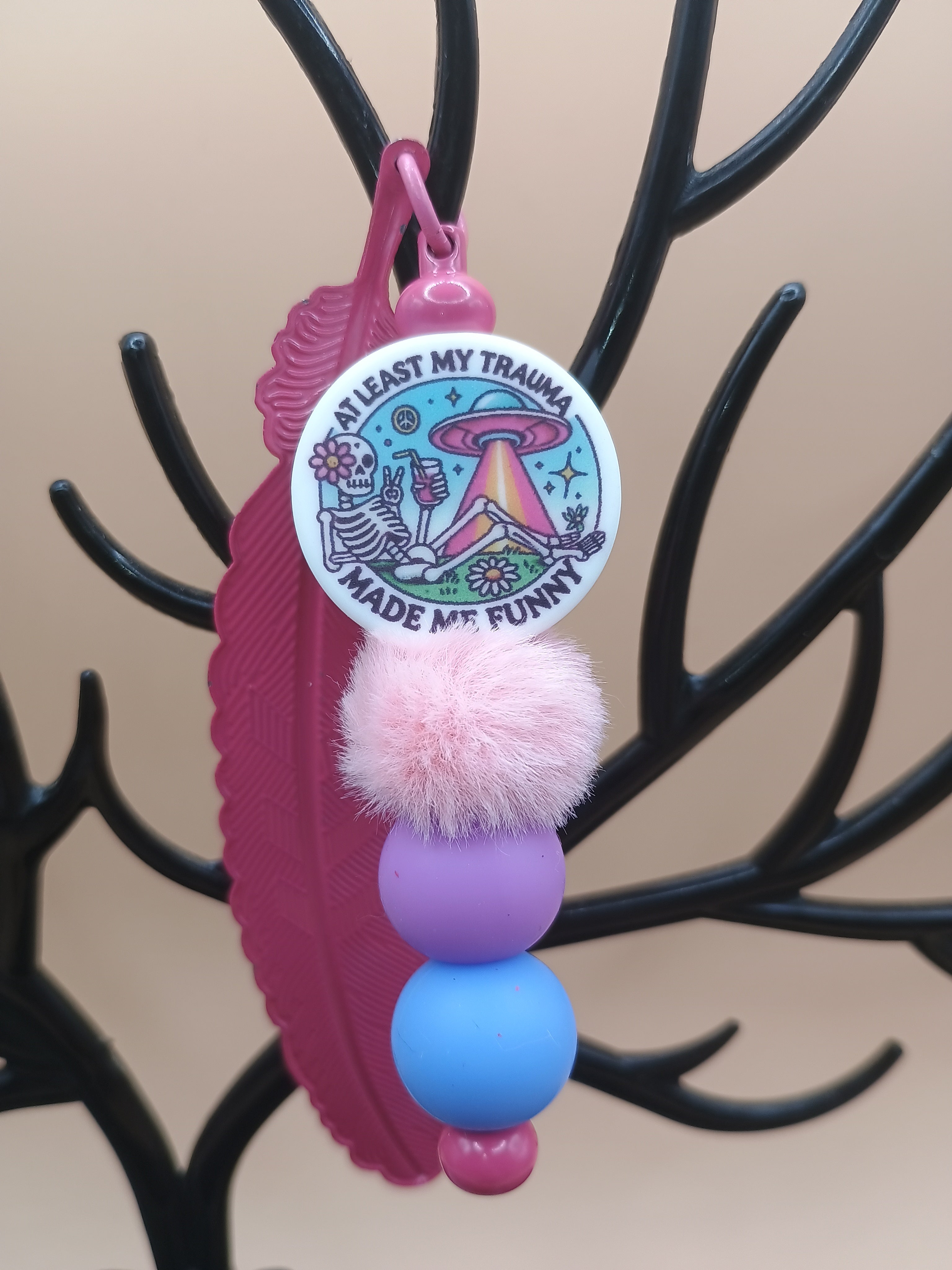 “Trauma Made Me Funny” Skeleton Space Feather Bookmark – Pink Metal Beaded Bookmark