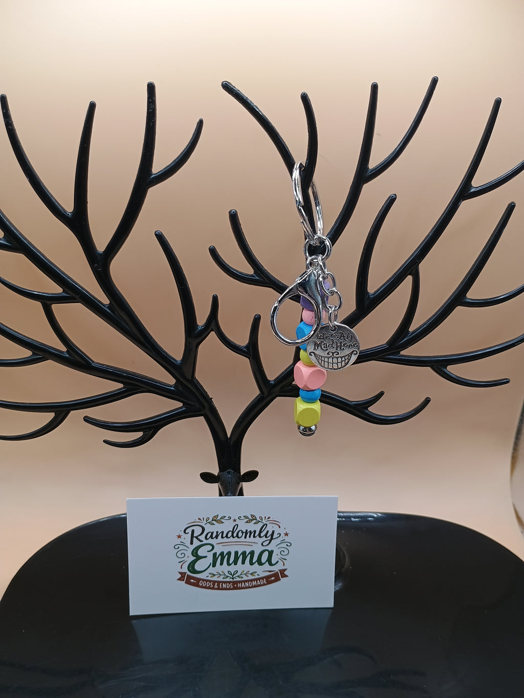 “We’re All Mad Here” Beaded Keychain – Silver Metal Keychain with Cheshire Smile Charm