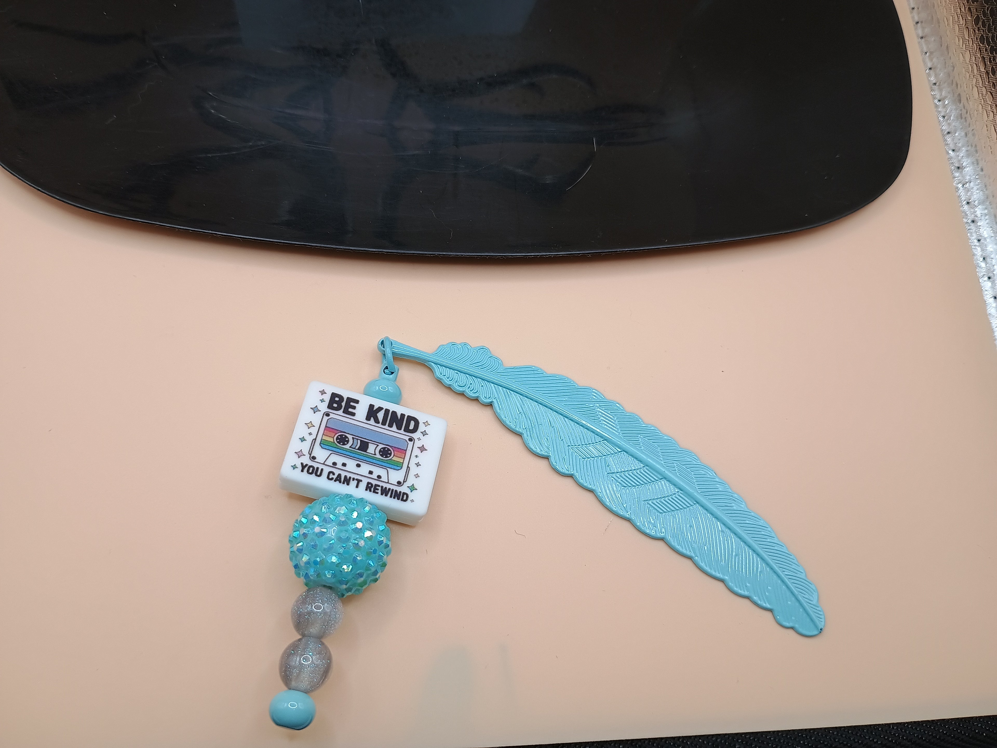 “Be Kind You Can’t Rewind” Feather Bookmark – Powder Blue Metal Beaded Bookmark